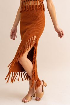 This Brown Tassle Detail Sweater Midi Skirt is crafted for comfort and style. Featuring tassle detailing, this midi skirt is the perfect addition to any outfit. The lightweight fabric offers a breathable fit, while the elastic waistband ensures a secure fit. Enjoy the sophisticated yet flattering look of this timeless piece. Fabric & fit: 100% Cotton Model is wearing size Small. Chic Spring Skirt With Tassels, Chic Skirt With Tassels For Spring, Spring Long Skirt With Tassels, Long Skirt With Tassels For Spring, Bohemian Long Skirt With Tassels For Summer, Spring Maxi Skirt With Tassels, Summer Cotton Skirt With Tassels, Casual Fringe Skirt For Fall, Casual Fringe Skirt For Spring