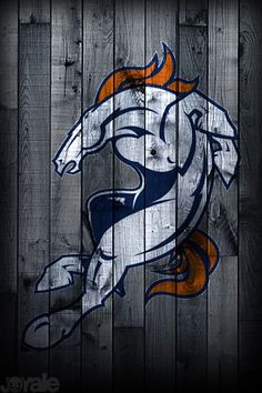 the chicago bears logo on a wooden fence with an orange and white horse painted on it