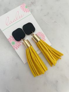 "These black and yellow tassel earrings are the perfect simple statement piece for gamedays or great for teacher or holiday gifts! Measures approximately 2.75\" in length. Giftbox included!" Yellow Fringe Jewelry Gift, Yellow Tassel Earrings As Gift, Yellow Fringe Earrings As Gift, Yellow Fringe Jewelry For Gift, Black Drop Tassel Earrings As Gift, Black Tassel Earrings For Gift, Black Tassel Earrings As Gift, Yellow Dangle Tassel Earrings Gift, Elegant Yellow Tassel Earrings For Gift