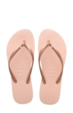 A sparkling crystal adorns the strap of this casual flip-flop that goes from beach to brunch with comfort and ease. Style Name:Havaianas Slim Crystal Flip Flop (Women). Style Number: 6113045.