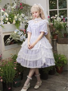 This elegant and enchanting one-piece Lolita dress features a beautiful light purple Edward neck design and a delicate white lace overlay skirt. The combination of the soft purple color and the intricate lace detail creates a classic and timeless look that is perfect for any Lolita fashion enthusiast. This dress is a must-have for anyone looking to add a touch of ethereal beauty to their wardrobe.  This price includes an OP only, others are not included.   	 		 			Size 			S 			M 			L 			XL 		 		 			Bust 			86 			90 			94 			98 		 		 			Waist 			68 			72 			76 			80 		 		 			Full Length 			94 			95 			96 			97 		 		 			Shoulders 			37 			38 			39 			40 		 		 			Sleeve Length 			27 			27.5 			28 			28.5 Purple Lace Dress With Ruffles, Purple Lace Dresses With Ruffles, Purple Lace Patchwork Dress, Feminine Lavender Lace Dress, Feminine Purple Lace Dress, Elegant Lavender Dress With Lace Trim, Purple Short Sleeve Dress With Lace Trim, Fuyume Hanamura, Steampunk Fashion Female