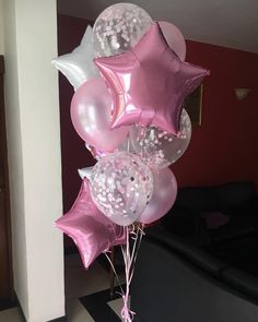 pink and white balloons in the shape of stars