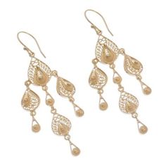 In 18k gold plated sterling silver elaborate filigree droplets are as scintillating as early morning dew. Expert in the legendary art of filigree Alfredo Inga designs and hand crafts a fabulous pair of chandelier earrings with a combined high polished and whitened finish. Teardrop-shaped Gold Plated Filigree Jewelry, Teardrop Filigree Chandelier Earrings, Filigree Teardrop Chandelier Earrings, Gold Plated Filigree Teardrop Jewelry, Ornate Yellow Gold Dangle Chandelier Earrings, Ornate Yellow Gold Chandelier Drop Earrings, Ornate Yellow Gold Chandelier Dangle Earrings, Gold Plated Filigree Dangle Jewelry, Yellow Gold Chandelier Earrings With Intricate Design