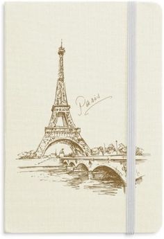 a drawing of the eiffel tower in paris on a white notebook with brown ink