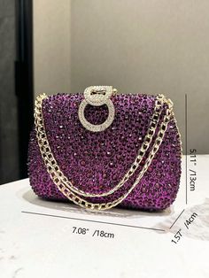 Introducing the Royal Radiance Evening Clutch - a stunning purple rhinestone clutch that adds a touch of elegance to any event. Crafted with care and precision, this clutch will make you feel like royalty. Perfect for any formal occasion, let the sparkling rhinestones add a touch of glamour to your look. Color : Purple Details : Rhinestone Magnetic : No Closure Type : Buckle Strap Type : Chain Bag Size : Mini Style : Glamorous Pattern Type : All Over Print Type : Box Bag Material : Aluminum Alloy Care Instructions : Do not wash Bag Height Bag Length Bag Width Strap Length 13 18 4 120 Purple Details, Yellow Pearl, Rhinestone Clutch, Evening Purse, Purple Rhinestone, Wash Bag, Purple Bags, Skull Design, Chain Bag