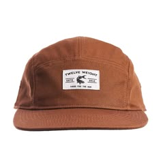 A special collection item from our friends at Twelve Weight. This is a classic 5-panel "camp style" hat made with 100% cotton twill. Slightly increased bill length for improved coverage. Additional twill front panel backer adds some structure and maintains a clean interior. Ships as a standard flat brim can also be molded to curve based on preference. - 100% cotton twill - Optic Black fabric under the visor eliminates glare - Wicking headband controls moisture - Adjustable clip & stretch loo 5-panel Camping Hat With Logo Patch, Cotton Trucker Hat 5-panel, Brown 5-panel Baseball Cap For Camping, Adjustable 5-panel Canvas Snapback Hat, Adjustable Canvas 5-panel Snapback Hat, Vintage 5-panel Hat For Outdoor Activities, Canvas 5-panel Hat For Outdoor Activities, Cotton Snapback Hat With Flat Bill For Camping, Cotton 5-panel Hat For Camping