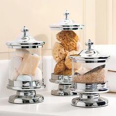 two salt and pepper shakers on a counter with bread in the jar next to them