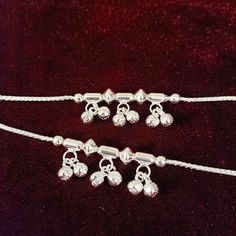 Beautiful Pair of anklets in silver. They have been adorned with small bells that make a beautiful noise. They are available in a few different sizes. Fits and sits like a curve on the ankles. Best for gifting or for personal use, wear it to any occasion and be the spotlight. Feel free to contact us at any time. We will try to promise you amazing shopping experience. Eye-catching and unique jewelry that will set you apart. Gift this piece to a loved one, and see their face light up with joy. Can Adjustable Anklets With Latkans For Festive Occasions, Adjustable Festive Anklets With Latkans, Adjustable Metal Anklets For Festivals, Adjustable Silver Anklets For Festivals, Adjustable Metal Anklet For Festive Occasion, Adjustable Silver Anklets For Festive Occasions, Saree Jewellery, Silver Pooja Items, Silver Anklet