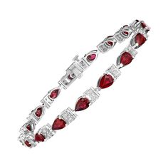 • A beautiful row of red pear shape rubies and white round brilliant cut diamonds encircle the wrist in this bracelet, set in 14KT gold. The bracelet measures 7" in length and has a combining total weight of approximately 8.50 carats. Each stone has been carefully matched and set by Hand in New York City. • Number of Pear Shape Rubies: 17 • Carat Weight: 7.50ctw • Rubies measure: 6x4mm • Number of Round Diamonds: 34 • Carat Weight: 1.00ctw • 7" Long • 14KT Gold • Available in White, Yellow, or Rose Gold Round Diamond Bracelet, Red Pear, Bracelet Tennis, Ruby Bracelet, Tennis Bracelet, Round Brilliant Cut Diamond, 14kt Gold, Pear Shape, Brilliant Cut Diamond