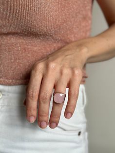 Introducing a radiant masterpiece from Moss Jewellery, behold the Square-cut Rose Quartz and Silver Ring with a captivating rose gold finish. This ring is a harmonious blend of natural elegance and contemporary chic. At its heart lies a generously sized, square-cut natural rose quartz, renowned for its soft, blush-pink tones that evoke a sense of serenity and love. The stone is expertly set in a high-quality silver base, elegantly complemented by a delicate rose gold coating, adding a touch of w Luxury Cushion Cut Morganite Jewelry, Luxury Morganite Cushion Cut Jewelry, Rose Gold Cushion Cut Morganite Ring, Elegant Cushion Cut Rose Gold Jewelry, Elegant Rose Gold Cushion Cut Jewelry, Formal Rose Gold Cushion Cut Jewelry, Pink Gold Morganite Ring With Gemstone, Modern Pink Rings With Polished Finish, Luxury Rose Gold Cushion Cut Jewelry