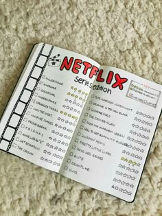 an open book with the words netflix and some sort of information on it sitting on a carpet