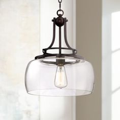 a light fixture hanging from a ceiling in a room