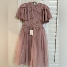 Gorgeous! Blush Mauve Colored Ivy City Co Dress Size Xxs. Nwt. Lovely Netted Fabric Dress With Flutter Style Sleeves And Tulle Lined Skirt. There Is Limited Or No Stretch At The Waistline. Perfect For Weddings, Parties, Cocktail Events, Or Just To Wear Any Day! This Dress Looks Immaculate. No Tears Stains Rips Or Known Flaws. Questions? Leave A Comment Below! Second Photo Is Stock Photo Short Sleeve Tulle Dress For Prom Season, Elegant Short Sleeve Tulle Mini Dress, Elegant Spring Fairy Dress For Bridesmaids, Elegant Fairy Dress For Bridesmaids In Spring, Elegant Summer Bridesmaid Fairy Dress, Fitted Fairy Dress With Short Sleeves For Spring, Short Sleeve Tulle Bridesmaid Dresses, Summer Bridesmaid Fairy Dress, Summer Fairy Bridesmaid Dress