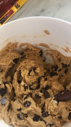 a bowl filled with cookies and chocolate chips