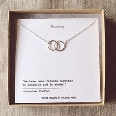 two intertwined rings necklace in a gift box