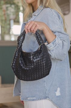 Add a touch of class to your accessories collection with this luxurious black small woven bag, from Melie Bianco. Constructed from hand woven vegan leather and designed with a top zipper opening, it has a stylish yet practical polka dot lining and gold-tone hardware. An interior zipper pocket ensures your valuables are kept safe and secure. Recycled Vegan Leather 11.5"W x 7.5"H x 1"D Handle Drop: 3.5" Zipper Closure Gold-Tone Hardware Interior Zip & Slot Pockets OEKO-TEX Certified Lining Fits up Black Woven Leather Hobo Bag For On-the-go, Chic Handheld Bag With Intrecciato Weave, Black Woven Leather Pouch Shoulder Bag, Chic Handheld Hobo Bag In Woven Leather, Chic Handheld Woven Leather Hobo Bag, Chic Black Bag With Woven Leather, Versatile Black Shoulder Bag With Intrecciato Weave, Black Intrecciato Weave Pouch Shoulder Bag, Black Intrecciato Weave Pouch Bag