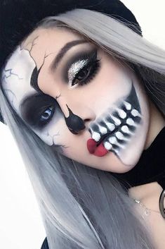 a woman with grey hair and makeup is posing for the camera while wearing skeleton makeup