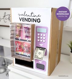 a cardboard vending machine with money in it's display case on a counter