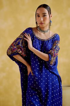 Blue tunic with bandhani woven motifs and gota patti, sequin, zari thread, metal beads, mirror embroidery on sleeves. Paired with draped pant. - Aza Fashions Bohemian Straight Kurta Blouse For Navratri, Blue Motif Tops For Festivals, Bohemian Style Blouse For Navratri, Bohemian Chikankari Embroidery Sets For Festivals, Festive Blue Bandhani Print Blouse, Blue Tunic Kurta For Festivals, Blue Tops With Motifs For Festivals, Blue Bohemian Blouse For Festivals, Bohemian Blue Blouse For Festivals