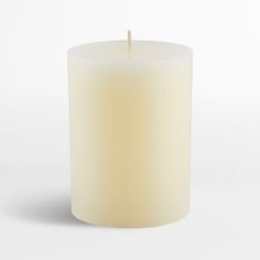 a white candle with a wooden stick sticking out of it's center, on a white background