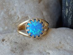 "Opal Gold Ring, Gemstone ring, Blue Opal Ring, October Birthstone,Opal blue Gold Filled Ring,Ocean Opal jewelry,Turquoise Opal Feminine Ring It will be a perfect gift for women. It is made of gold filled 14k and Opal. Measurements: Size- all The center stone is 10mm Please select in the \"type box\". The ring will be packed in a gift box. FOR MY RINGS COLLECTION HERE: https://www.etsy.com/il-en/shop/rebekajewelry?section_id=14282915&ref=shopsection_leftnav_9 TO GET TO MY SHOP: https://www.e Blue Opal Round Ring, Blue Cabochon Opal Ring For Anniversary, Blue Opal Promise Ring, Blue Round Opal Ring, Blue Cabochon Opal Ring, Anniversary Blue Cabochon Opal Ring, Blue Oval Opal Ring Fine Jewelry, Turquoise Opal Rings Perfect For Gifts, Turquoise Opal Rings As Gift