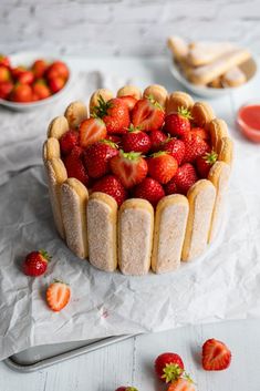 there is a cake with strawberries on it