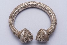 A quality 900 silver old Jhanjar bangle from India. A hollow embossed floral design 1940's tribal art piece. 8 inch inside dimension. 20cm 112grams Traditional Carved Bangle For Wedding, Traditional Carved Bracelets For Wedding, Traditional Carved Wedding Bracelets, Silver Carved Ornate Bangle, Traditional Carved Bangle Jewelry, Silver Carved Bangle For Ceremonial Wear, Silver Carved Bangle For Ceremonial Occasions, Traditional Silver Carved Cuff Bracelet, Traditional Sterling Silver Bracelet With Intricate Design For Festivals