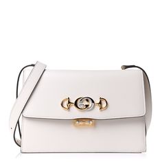 Authentic New Gucci Small Gg Zumi Leather Shoulder Bag Color: Mystic White Made In Italy New With Tags Details: Top Flap With Clasp Closure. Silver Gold-Toned Metal Hardware With Adjustable Strap For Shoulder Or Crossbody Wear. 3 Compartments And A Zip Pocket. Size: 9.5" X 6.5" X 2.5" Elegant Gold Shoulder Bag With Horsebit Detail, Elegant Shoulder Bag With Horsebit Detail, Elegant Rectangular Shoulder Bag With Horsebit Detail, White Gucci Bag For Everyday Luxury, Elegant Gucci Bag With Horsebit Detail, Elegant Evening Bag With Horsebit Detail, White Gucci Shoulder Bag For Evening, Elegant Rectangular Gucci Bag, Elegant Gucci Rectangular Bag