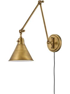 an antique brass swing arm wall light