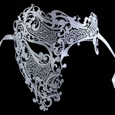 Made for men, can be worn on women as well. This deluxe, venetian-style decor mask features crystals, rhinestones and designs, will surely make you stand out stylishly. All of the masks are hand made and intricately designed offering each a unique flair. White Venetian Mask, Elegant Silver Masks As Gift, Silver Venetian Mask For Theater, Silver Venetian Masks For Theater, White Venetian Masquerade Mask As Gift, Venetian Silver Mask For Theater, White Venetian Masquerade Mask For Gift, White Venetian Masks For Theater, Venetian White Mask For Theater