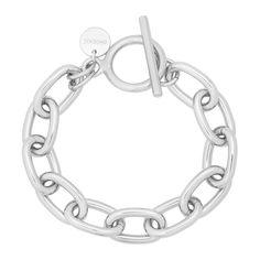 The Alana toggle bracelet is a thick rounded link chain, fastened with a toggle clasp. Material: Brass Plating: 10K Gold or Rhodium-silver Chain has a clear protective coating to prevent from quick wear and tarnishing. Chain links measure: 20mm long x 12mm wide x 3mm thick Available in the following Lengths: 6", 7", 8", 9" Our jewelry is always handmade from sustainable materials in the USA. ** EDITORS NOTE: Please measure your wrist circumference before choosing a bracelet length. The width and