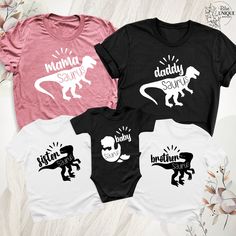 Dada Mama Baby Saurus Gift Shirt, Matching Family Saurus T-Shirt, Daddysaurus Shirt, Mamasaurus Dinosaur Mama Tee, Babysaurus Boys Girls Outfits, Fathers Day Mothers Day Christmas Tee, Dada Mama Mini Baby Shirts Outfits, Family Matching Shirt, Mommy and Me Shirts, Daddy and Me Tees, Mama Dada Mini Shirt, Mothers Day Shirt. Hello, Welcome to Blue Unique Boutique, your destination for unique and handcrafted shirts! I'm Eve! I have been thinking about creating my business for a long time and now I Unisex Dinosaur Print Crew Neck Top, Family Matching White Dinosaur Print T-shirt, White Dinosaur Print T-shirt For Family Matching, White Family Matching T-shirt With Dinosaur Print, Family Matching White T-shirt With Dinosaur Print, Unisex White Top With Dinosaur Print, Funny Cotton Top With Dinosaur Print, Funny Black T-shirt With Dinosaur Print, Fun Short Sleeve Dinosaur Print T-shirt