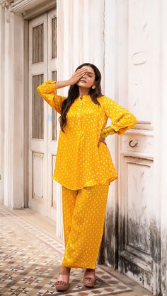 Slay this festive season in style! Bright Sunshine Yellow Bandhani Co-ord set made in Modal Silk Hand Tie Dyed Short Top + Pallazo set with closed neck Model height is 5.3” and is wearing a size S Loose Fit Wash Care : Dry Clean Only Festive Co Ord Sets, Traditional Dabka Blouse For Festive Occasions, Unstitched Long Sleeve Pant Set For Festive Occasions, Festive Dabka Work Pant Set For Eid, Unstitched Gold Sets For Festive Occasions, Gold Unstitched Sets For Diwali, Unstitched Gold Sets For Diwali, Gold Sets For Diwali, Festive Anarkali Pant Set With Long Sleeves