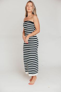 This dress is a summer must-have, whether you're looking forward to a cruise, a week of island-hopping in the Mediterranean, or a staycation at the neighbor's pool! The Eventide Maxi Dress is crafted from a comfortable cotton blend and features a slimming, strapless silhouette. Pair it with slides or tennis shoes for sightseeing, or with wedges for dinner at the resort! FIT: Runs true to size - fitted. MODEL: Model is 5’7” / wearing a small. MATERIAL: 48% Cotton, 40% Acrylic, 12% Nylon. GARMENT Summer Strapless Dress For Beach Cover-up, Strapless Summer Dress For Beach Cover-up, Summer Strapless Dress For Beach Season, Summer Strapless Dress For Vacation Beach Season, Summer Strapless Dress For Beach Vacation, Summer Strapless Dress For Vacation, Strapless Beachwear Dress For Beach Season, Strapless Midi Dress For Summer Beach, Chic Strapless Summer Beach Dress