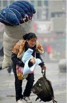 a woman is pushing a large stuffed animal on her back while another person holds onto the bag