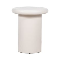 a white stool sitting on top of a white floor