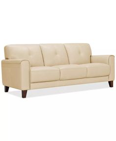 a cream colored couch on a white background