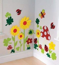 the wall is decorated with colorful flowers and ladybugs