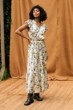 Between the pretty floral print and all those ruffles, this tiered maxi dress exudes romance. It's tied at the neckline, layered beautifully at the sleeves, and comfortably cinches in at the waist. •Split neckline with self-tie •Ruffle trim •Layered short sleeves •Elasticized waist •Tiered Item Number: 96222 100% POLYESTER Dress Length: 54 1/2" Tiered Floral Print Midi Dress For Daywear, Tiered Midi Dress With Floral Print For Daywear, Floral Print Tiered Dress For Garden Party, Feminine Sleeveless Floral Tiered Dress, Tiered Floral Dress For Garden Party, Floral Print Maxi Length Tiered Dress For Brunch, Feminine Tiered Maxi Dress For Garden Party, Feminine Maxi Length Tiered Dress For Garden Party, Tiered Floral Dress With Ruffles For Daywear