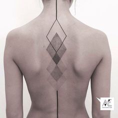 the back of a woman's neck with geometric designs on it