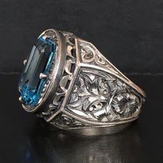 This unique, handcrafted solid silver piece of art is an exquisite one-of-a-kind creation from Turkish artisan jewelers. With its off-handed engravings, it's sure to be a treasured piece of jewelry for years to come. Available in size 10, with worldwide express shipping. Metal: 925 Sterling Silver Gemstone: natural Aquamarine (16x12x10mm) Size: US10 Luxury Silver Engraved Filigree Ring, Luxury Engraved Silver Filigree Ring, Antique Sterling Silver Engraved Ring With Intricate Design, Antique Engraved Ring With Intricate Design In Sterling Silver, Silver Victorian Signet Ring With Polished Finish, Victorian Silver Signet Ring With Polished Finish, Victorian Silver Engraved Ring For Formal Occasions, Handmade Antique Silver Engraved Ring, Elegant Silver Carved Engraved Ring