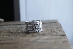 "These rings are so perfectly imperfect just like life! I haven't taken mine off since making them. These rings start out as heavy gauge fine silver wire which I hammer and fuse together to create these little beauties. Each ring is roughly 2mm wide and in an Uppercase font. If looking for a lowercase font please see this listing https://www.etsy.com/listing/270964826/personalized-stackable-mothers-ring-2mm?ref=shop_home_active_1 Price listed is for one ring only. Multiple number of rings can be Adjustable Stamped Stackable Rings For Everyday, Personalized Adjustable Meaningful Stackable Rings, Meaningful Personalized Adjustable Stackable Rings, Customizable Adjustable Stackable Rings For Everyday, Cute Adjustable Ring For Everyday, Cute Adjustable Everyday Rings, Custom Name Adjustable Stackable Rings For Personalized Gift, Personalized Adjustable Stackable Rings For Birthday, Customizable Stackable Rings As Gift