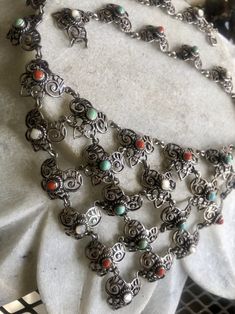 Circa 1800s Beautiful Art Nouveau Austro Hungarian Sterling Silver Coral Persian Turquoise Mother of Pearl Antique Festoon Bib Necklace See matching earrings in link below https://www.etsy.com/listing/693901515/circa-1800s-beautiful-art-nouveau-austro?ref=shop_home_active_1&frs=1 Anniversary Art Nouveau Filigree Necklace, Luxury Art Nouveau Formal Necklace, Silver Necklace With Intricate Art Nouveau Design, Silver Filigree Art Nouveau Necklace, Luxury Art Nouveau Pearl Pendant Necklace, Austro Hungarian, Persian Turquoise, Usa Jewelry, Bib Necklaces