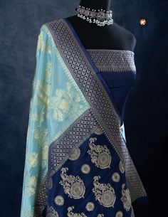 Indulge in luxury with our Sky Blue Khaddi Silk saree, adorned with delicate Golden Jaal work. Featuring a lightweight and airy fabric, this saree offers both comfort and elegance. Elevate your style with this beautiful saree and leave a lasting impression on any occasion! Luxury Blue Katan Silk Dupatta, Luxury Royal Blue Banarasi Silk Dupatta, Blue Bollywood Banarasi Silk Pre-draped Saree, Blue Wedding Pre-draped Saree With Zari Weaving, Traditional Blue Pre-draped Saree With Dupatta, Blue Pre-draped Saree With Pallu For Wedding, Blue Pre-draped Saree With Sheer Dupatta For Festivals, Festive Blue Art Silk Pre-draped Saree, Elegant Blue Pre-draped Saree With Zari Weaving