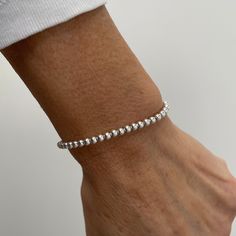 The sterling silver lariat ball bracelet is a fully adjustable lariat bracelet, making it the perfect fit for virtually any size wrist. Beautiful on its own or layered with other bracelets, it's an elegant and versatile piece for any occasion. The bead to tighten or loosen the bracelet adjusts effortlessly along the chain.    💖 Details 925 Sterling Silver Balls: approx 3 mm 💕 Online store: www.thejewellerytree.net 💕 If you like the jewellery, FOLLOW ME to stay up-to-date with new designs & special offers  Socials: @myjewellerytree OR  https://www.facebook.com/thejewellerytree1/  💕 Need more info, feel free to email - I'd love to help 💕And please visit my store https://www.etsy.com/au/shop/TheJewelleryTreeCo to see lots more quality sterling silver and gemstone jewellery We care about Adjustable Polished Beads Sterling Silver Bracelet, Silver Flexible Bracelet For Everyday Wear, Silver Flexible Bracelets For Everyday Wear, Everyday Flexible Silver Bracelets, Adjustable Sterling Silver Charm Bracelet With Round Beads, Sterling Silver Adjustable Charm Bracelet, Minimalist Silver Flexible Bracelet, Minimalist Flexible Silver Bracelet, Adjustable Flexible Sterling Silver Bracelets