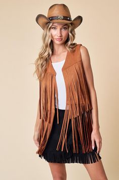 Introducing our Maple Fringed Vest! A versatile and stylish addition to your wardrobe. Crafted with soft, lightweight fabric, this vest offers both comfort and style for any occasion. The fringe detailing along the hem adds a bohemian touch, while the open-front design allows for easy layering. Elevate your outfit with this chic vest that's perfect for adding flair to any look. Soft and lightweight fabric for all-day comfort Fringe detailing along the hem adds a bohemian flair Versatile open-front design allows for easy layering Perfect for adding style to any outfit, from casual to dressy Trendy Summer Fringe Outerwear, Trendy Summer Outerwear With Fringe, Bohemian Outerwear With Frayed Hem For Festivals, Bohemian Spring Outerwear With Fringe, Summer Bohemian Outerwear With Frayed Hem, Sleeveless Festival Outerwear, Brown Fringed Tops For Festival, Brown Fringe Tops For Festival, Brown Fringe Top For Festival