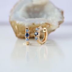 Genuine Ombre Blue Sapphire Gemstones 3 Stones Huggie Hoops/ Solid 14k Yellow Gold Earrings. Great Gift For Mom, Sister, Friend, Girlfriend and Daughter. Also available in Rose Gold, White Gold and Yellow Gold. *Product info: ★Details ★ SKU Code : 2554 ★Purity : Solid 14k Gold ( Also available in 9k & 18k Solid Gold) ★Metal : Yellow Gold ( Also available in Rose Gold & White Gold) ★Gemstone : 100 % Genuine Blue Sapphire ( Also available in Other Gemstone) ★Stone Shape : Round ( Also available in Elegant Blue 14k Gold Hoop Earrings, 14k Gold Birthstone Huggie Earrings As Gift, Blue Sterling Silver Huggie Earrings, Blue Fine Jewelry Huggie Earrings For Gift, Blue Fine Jewelry Huggie Earrings As Gift, Blue Huggie Earrings Fine Jewelry Gift, 14k Gold Huggie Earrings With Birthstone For Anniversary, Elegant Blue 14k Gold Huggie Earrings, Elegant Blue Huggie Earrings For Everyday Wear