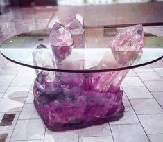 a glass table with purple crystals on it