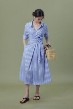 French Chic with Striped Shirt Dress Elegance Step into the world of French artistry with our Wrap Waist Stripe Shirt Dress. Made of 100% cotton, it boasts a delicate drape and smooth touch. The wrap waist design enhances its casual yet feminine vibe. Style #: WWSI368 Summer Office Dress With Stretch, Blue Midi Dress For Summer Office Wear, Stretch Summer Office Dress, Spring Stretch Shirt Dress, Blue Cotton Office Dress, Fitted Shirt Dress For Summer Office Wear, Light Blue Shirt Dress For Summer Workwear, Elegant Blue Cotton Shirt Dress, Fitted Light Blue Shirt Dress For Summer