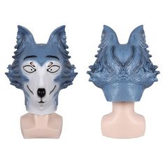 two blue and white wolf head masks sitting on top of each other